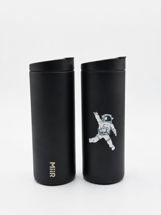 LEUNE x MiiR black travel mug with astronaut graphic